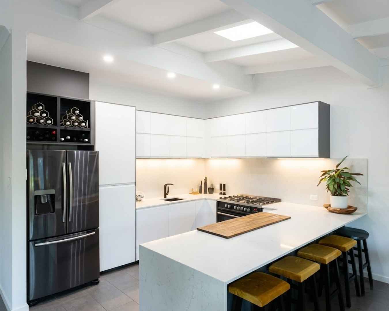 Completed modern kitchen renovation in Adelaide with custom cabinetry and stone benchtops